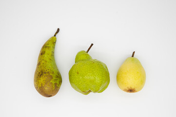 3 different pears on a white background