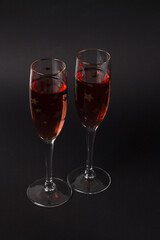 Two Champagne glasses on the black background. Composition for Valentine's day