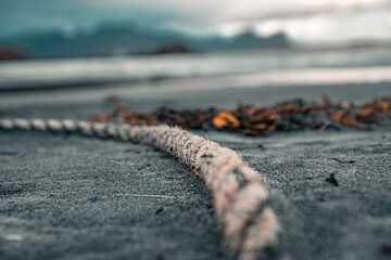 Rope in sand on a beach in Norway