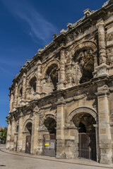 Fototapeta premium Ancient Nimes Roman Amphitheatre. Nimes Arena (70 CE) - one of the best-preserved amphitheaters in the world. Nimes, Occitanie region of southern France.