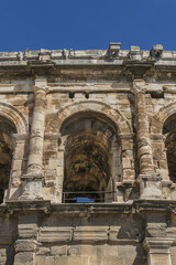 Obraz premium Ancient Nimes Roman Amphitheatre. Nimes Arena (70 CE) - one of the best-preserved amphitheaters in the world. Nimes, Occitanie region of southern France.