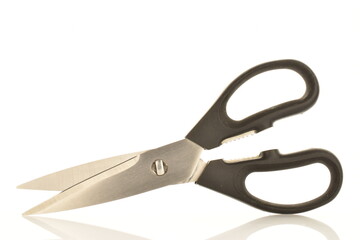 One metal scissors with black plastic handles, for the kitchen, close-up, isolated on white.