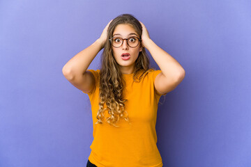 Young caucasian cute woman being shocked, she has remembered important meeting.