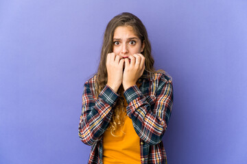 Young caucasian cute woman biting fingernails, nervous and very anxious.