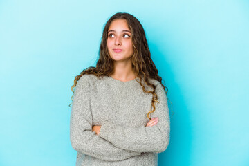 Fototapeta premium Young caucasian curly hair woman isolated dreaming of achieving goals and purposes