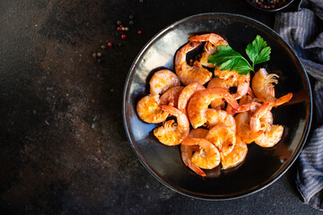 fried shrimps spices seafood crustacean prawn on the table for healthy meal snack outdoor top view...