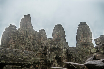 Fototapeta premium Bayon the central temple of Angkor Thom, late 12th century. It rains in the rainy season. (Cambodia, 04.10. 2019)