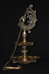 Fototapeta na wymiar antique brass oil lamp with a chain