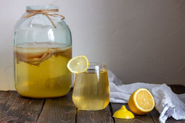Fermented Kombucha drink in a glass jar. Selective focus, place for text.