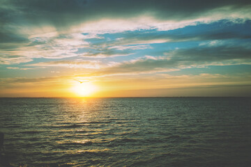 Naklejka premium Seascape in the early morning. Sunrise over the sea with beautiful sky