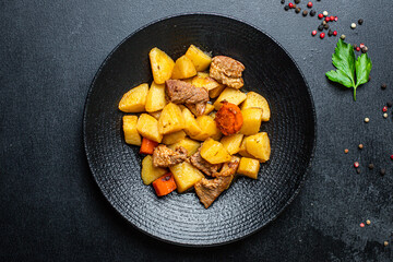 goulash meat with potatoes stewed vegetables and pork on the table for healthy meal snack outdoor...