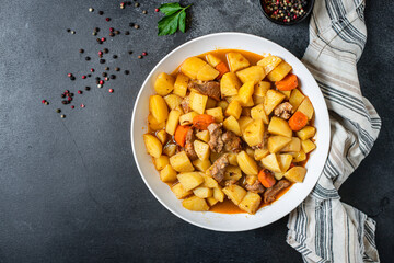 goulash meat with potatoes stewed vegetables and pork on the table for healthy meal snack outdoor...