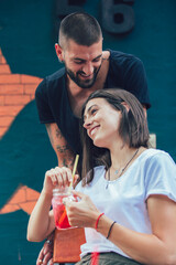 Beautiful loving couple sitting in a cafe drinking coffee and enjoying in conversation.