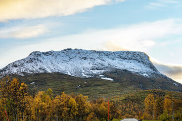 Snow mountains with a cloudy sky in north Norway