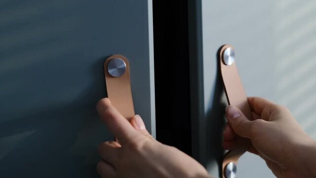 Close up hand open wooden cabinet. Slow motion video. stock footage
