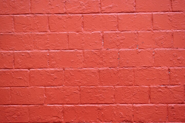 Red brick wall texture. Painted brick wall. Red. Background.