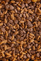 Dried cat food, abstract texture background.