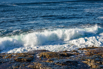 Waves flowing around rocks in north Norway
