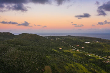 Aerial view above scenery of Curacao, Caribbean with ocean, coast, hills, lake