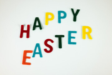 Happy Easter in colors on the white background