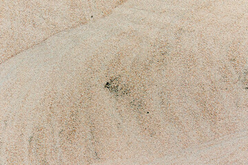 Apply sand rubbing plaster to masonry on concrete. Scratched and cracked dirty weathered sand textured plaster surface texture.