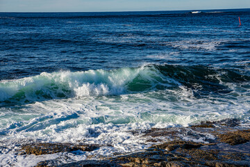 Waves flowing around rocks in north Norway