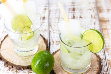 lemon and cachaça popsicle, drink from Brazil called caipirinha served with alcoholic drink ice cream.