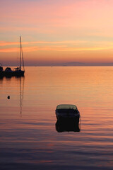 Small boat in the pier and beautiful sunset. Landscape in Split, Croatia. 