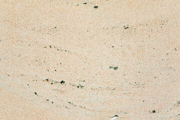 Apply sand rubbing plaster to masonry on concrete. Scratched and cracked dirty weathered sand textured plaster surface texture.