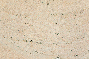 Apply sand rubbing plaster to masonry on concrete. Scratched and cracked dirty weathered sand textured plaster surface texture.