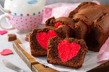 St. Valentine's Day, Mother's Day or Birthday festive dessert. Homemade sweet chocolate brownie with hearts for Valentine's Day on a stone countertop.