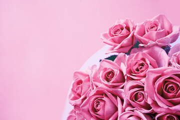 Background of beautiful pink roses with copy space. High quality photo