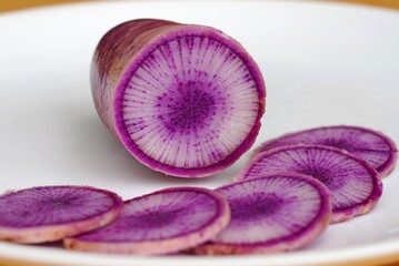 Slices of purple and white Blue Meat radish