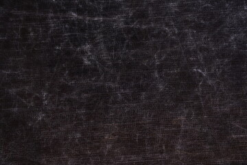 The texture of scratches on fabric on a black background