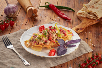 Beans salad on wooden background, vegetarian food