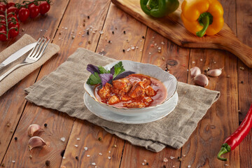 Hungarian goulash soup bograch, wooden background