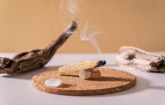 Palo Santo sticks on a light background.Aromatherapy religious rituals  meditation.Wellness with aromatherapy and the occult.Healing incense Palo  Santo.Organic incense of the holy ritual tree.Ibiokai Stock Photo