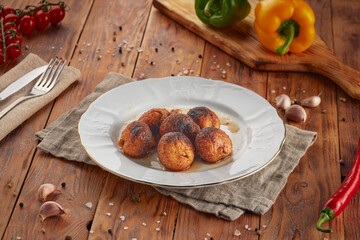 Grilled champignon mushrooms BBQ, wooden background