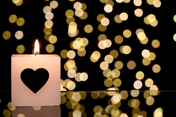 Valentine's Day background. a candle with a heart. Valentine's Day concept. Flat view, top view, copy space