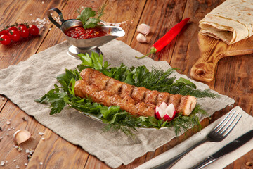 Kebab grill BBQ, wood background