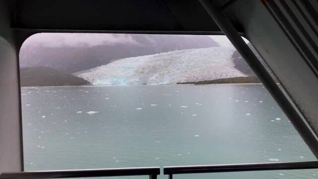 View of an ice from the chamber of a cruise ship while sailing inside the Patagonian fjords and Tierra del Fuego. Chile.
