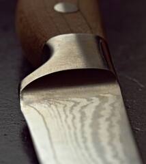 Vegetable knife in shallow depth of field. Close up of vegetable knife. Knife with wooden handle