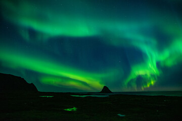 strong northern lights (aurora borealis) in the norwegian wilderness