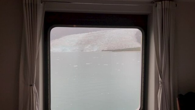 View of an ice from the chamber of a cruise ship while sailing inside the Patagonian fjords and Tierra del Fuego. Chile.