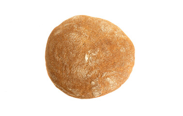 Top view of a whole loaf of wheat bread isolated on white background.