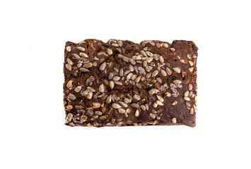 Top view of a whole loaf of rye bread with sunflower seeds.