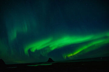 strong northern lights (aurora borealis) in the norwegian wilderness