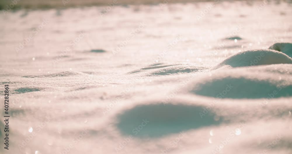 Poster Close-up view of microtexture of the snow surface. Shine and sparkle warm light from the Sun.