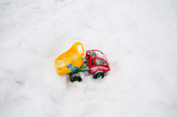 abandoned toy truck in snow