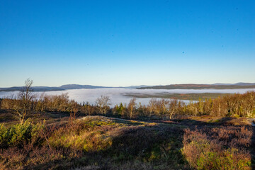 Obraz premium Fog over a valley of Lierne national park in Norway
